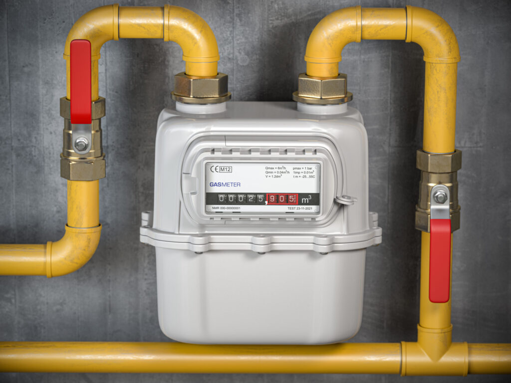 Gas meter connected to yellow flexible gas lines, featuring shut-off valves and pressure indicators, emphasizing safe gas line installation and maintenance.