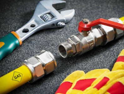 Gas line installation tools including a wrench, gas valve, and yellow gas line, emphasizing professional plumbing services for safe gas connections in Canton, GA.
